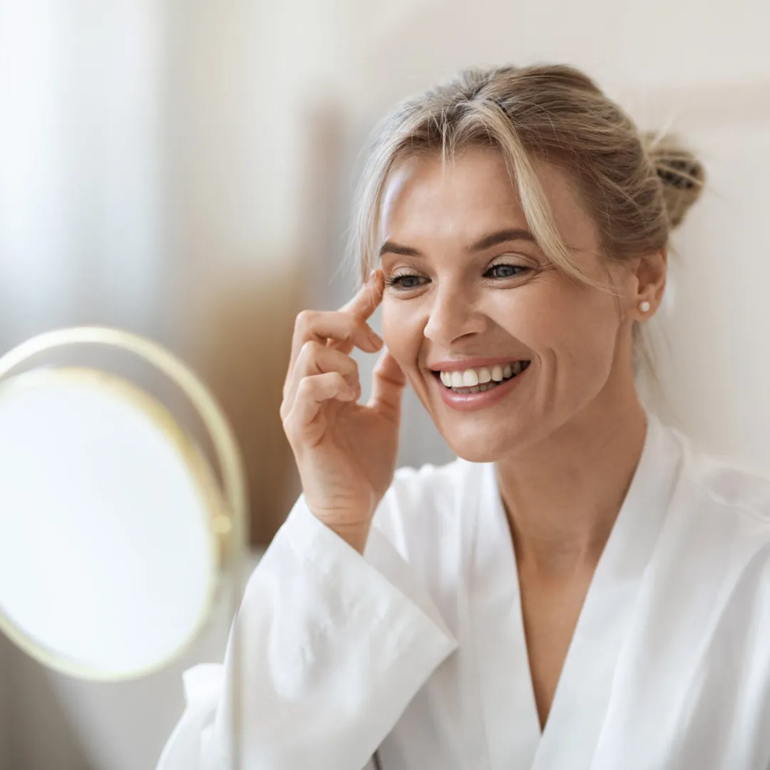 Smiling woman with glowing skin after professional skincare treatment at DermaCare in Tri-Cities