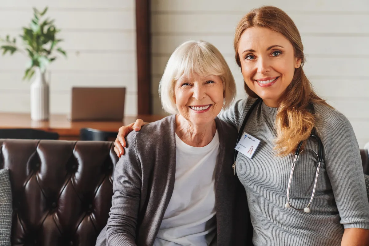 portrait-of-friendly-nurse-cares-for-elderly-woman