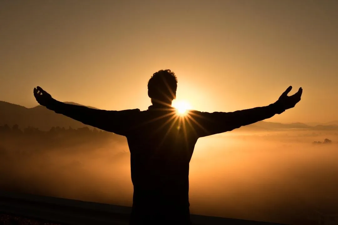 Contractor feeling peace of mind at sunrise after securing a business umbrella liability insurance policy