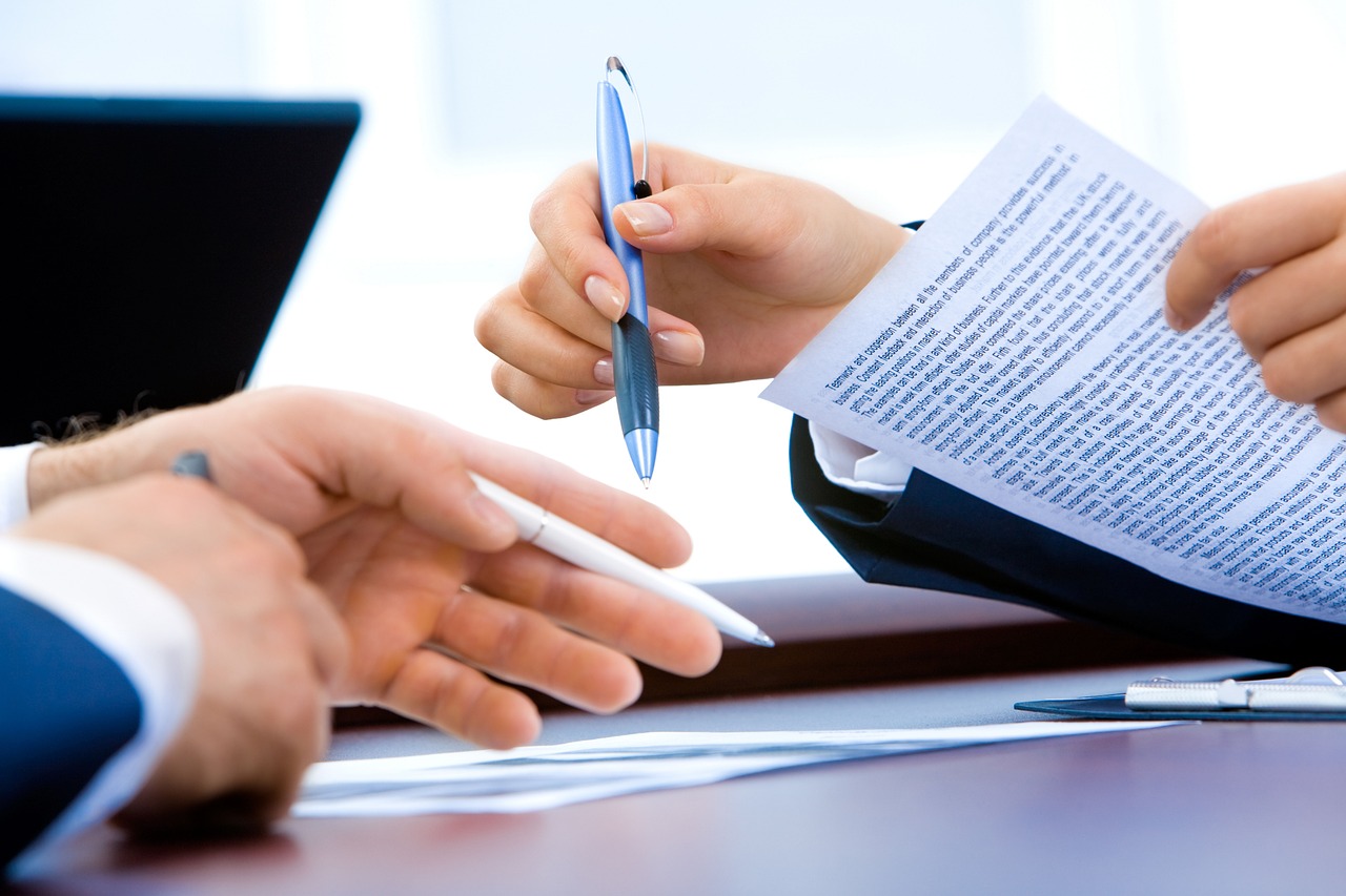 Business owner signing documents to secure commercial vehicle insurance from one of the best car insurance companies