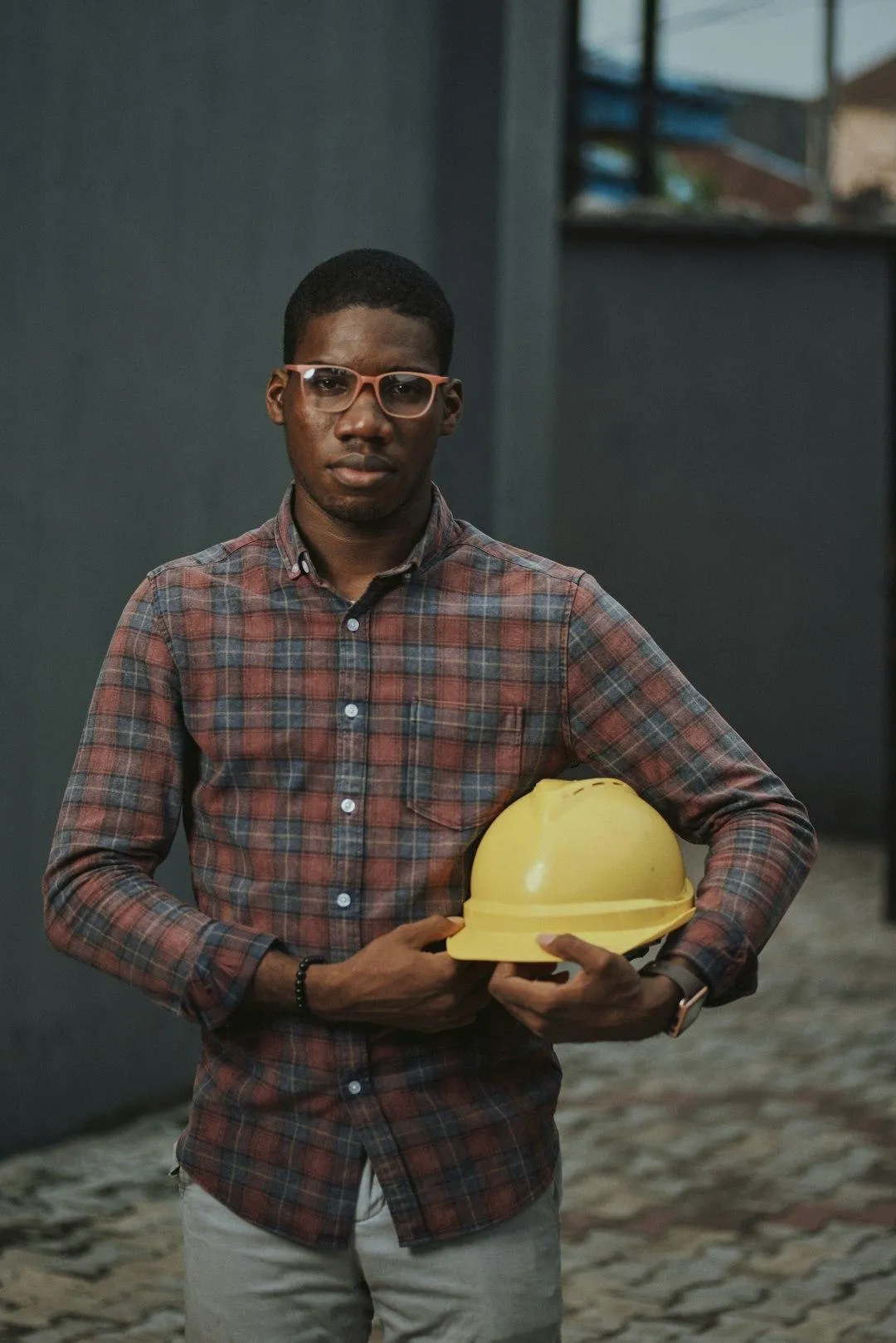 General contractor in Texas wearing hard hat — a reminder of why workers compensation insurance is essential for job site safety.