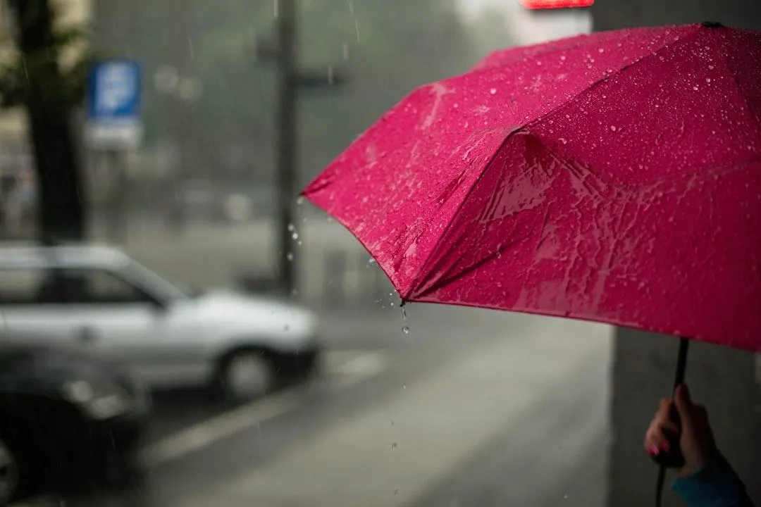 Business umbrella insurance concept symbolized by an umbrella in the rain offering extra coverage protection