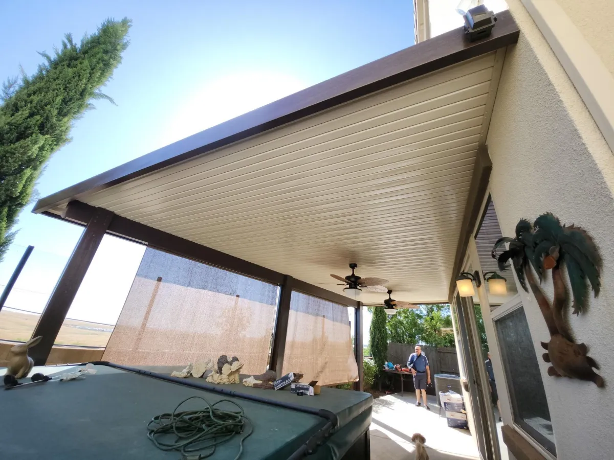 A patio covered in lots of chairs and tables