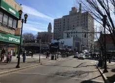 Rooftop deck with furniture and railing in Getty Square Yonkers
