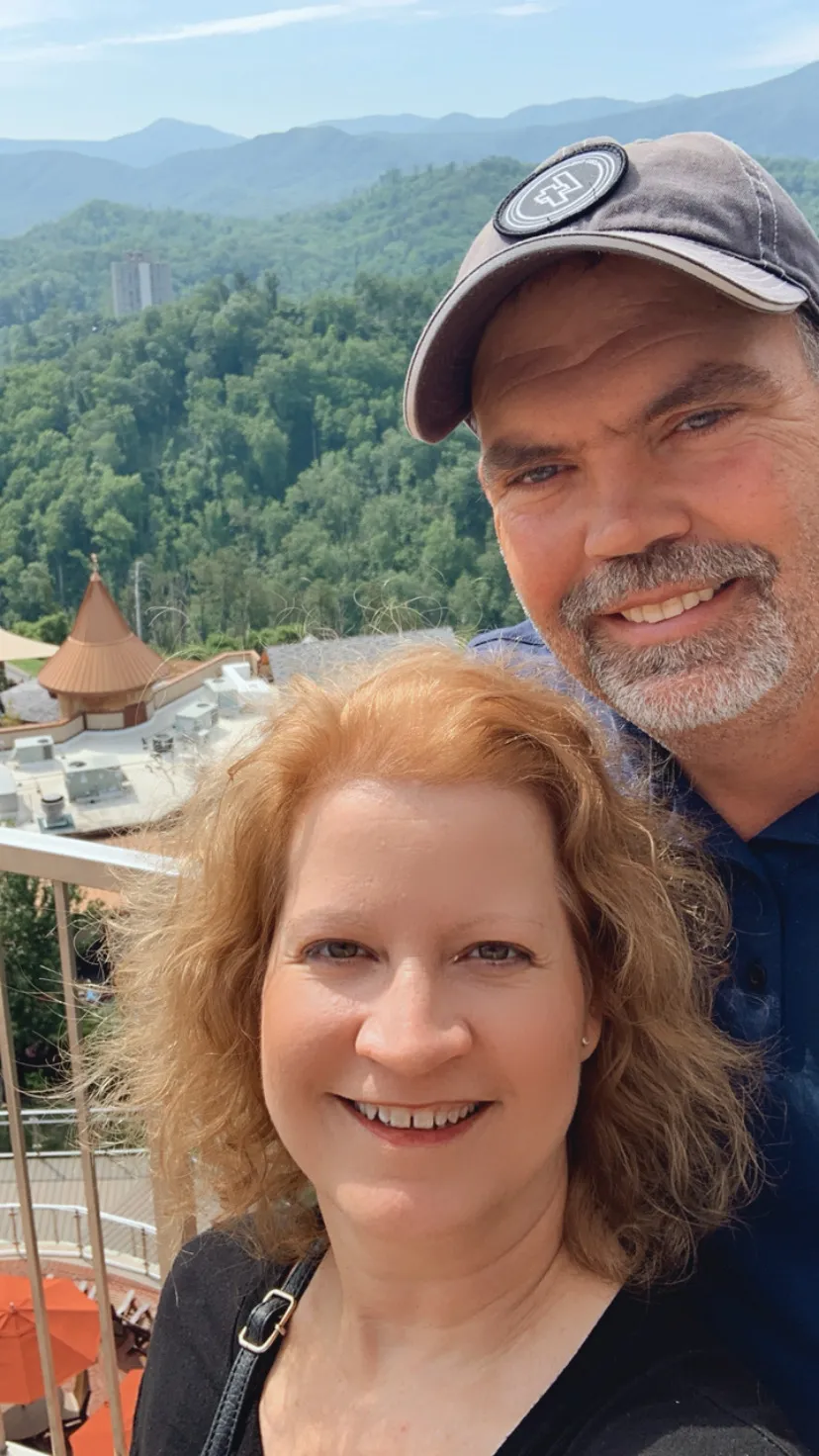 Kim Roth and her husband smiling together on vacation, representing the balance between personal life and professional passion in entrepreneurship.