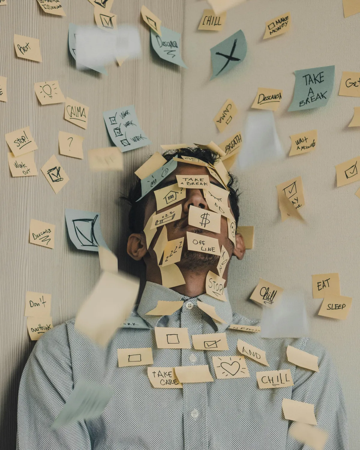 person covered in post it notes with to-do items