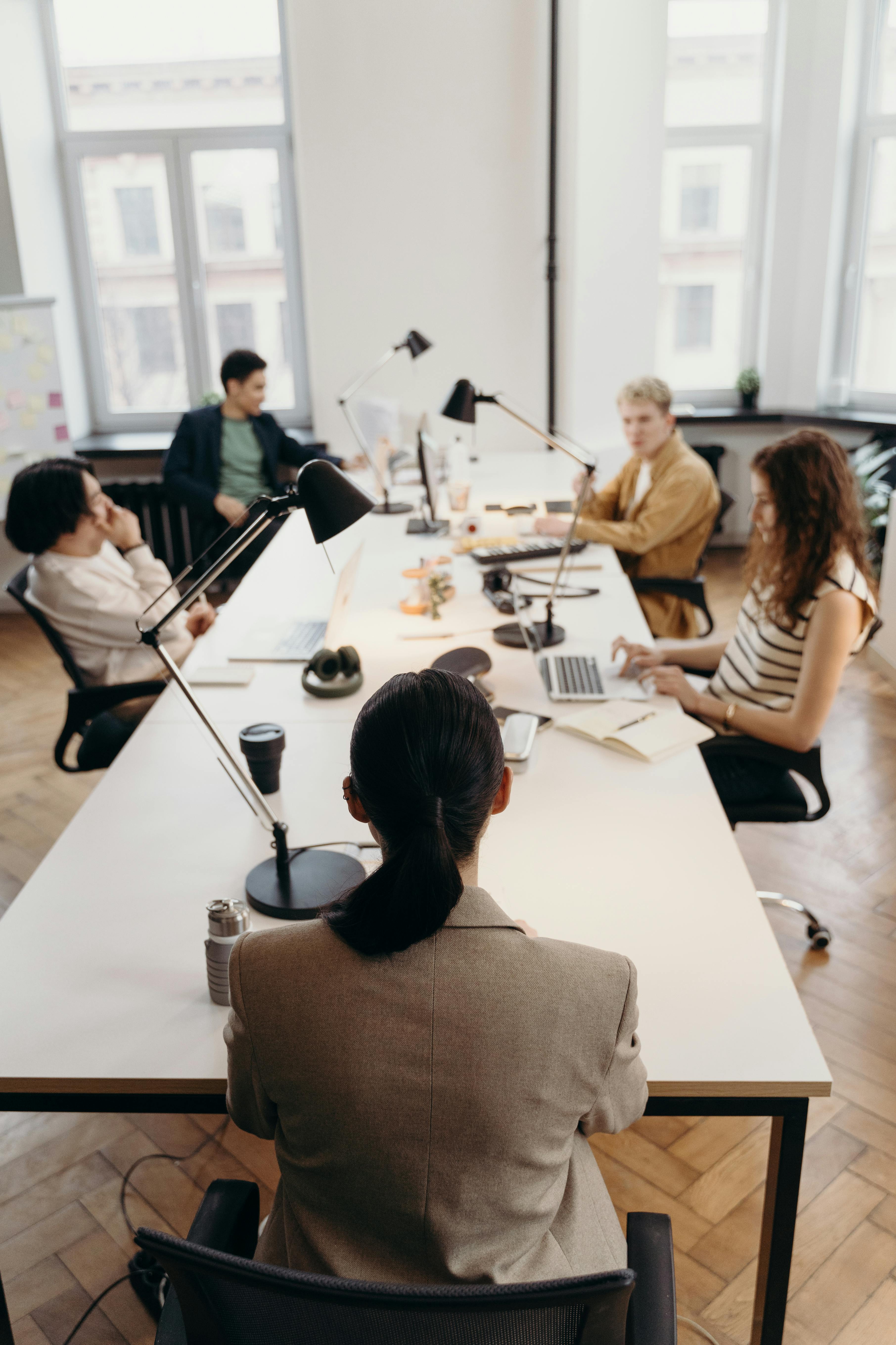 a group of people standing around in a room