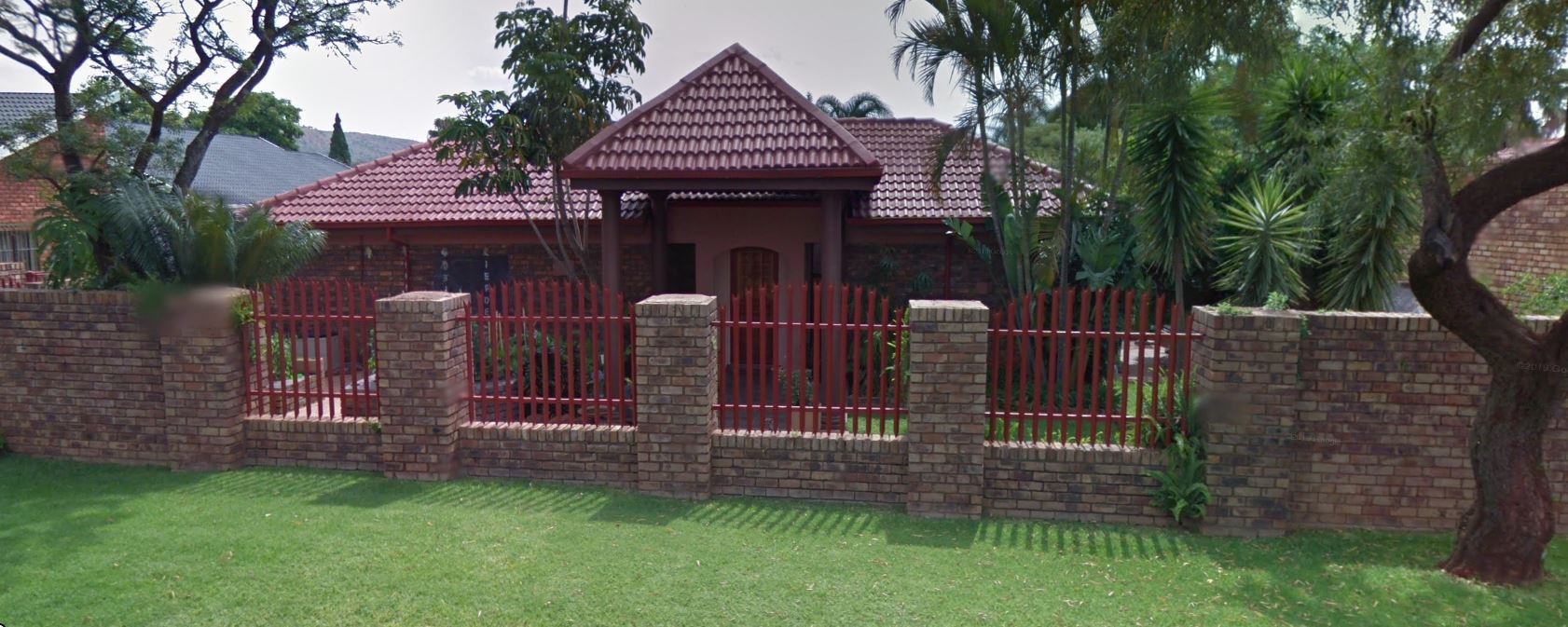 A digital rendering of a mixed-use real estate project featuring modern architecture, green rooftop spaces, and active street-level retail, set in a vibrant urban neighborhood.