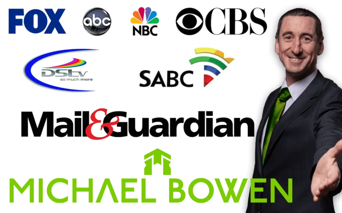 Portrait of Michael Bowen, co-founder of ZAHomes, in a modern office setting, wearing a navy suit and smiling confidently.