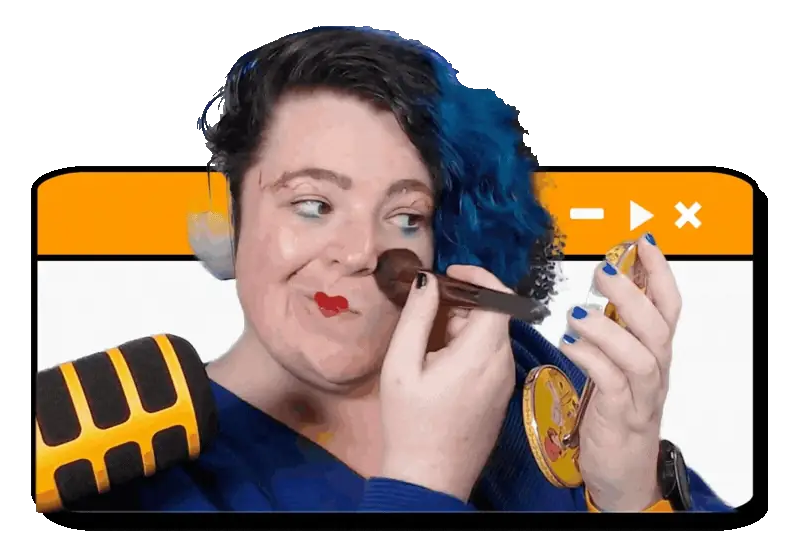 Zoë Wood dusting her cheek with a makeup brush while holding a compact mirror, with a large microphone in the corner.