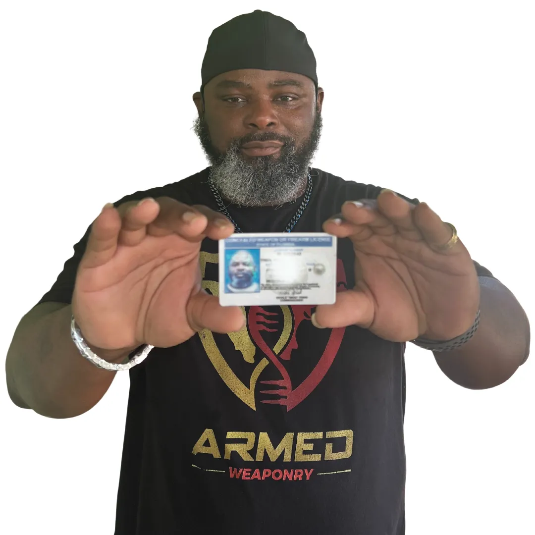 Certified NRA Instructor Sean Tyson holding concealed permit