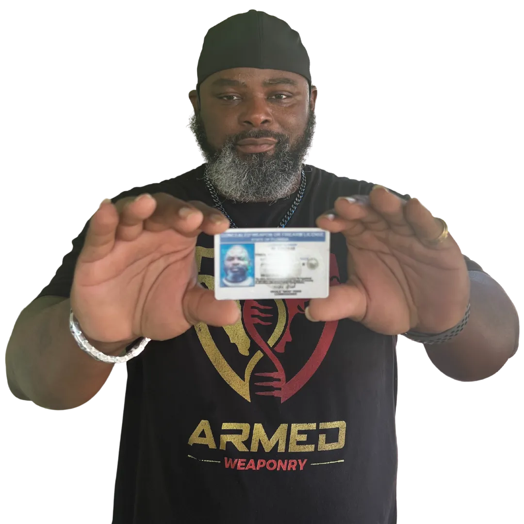 Certified Firearm Instructor Sean Tyson holding ccw Permit