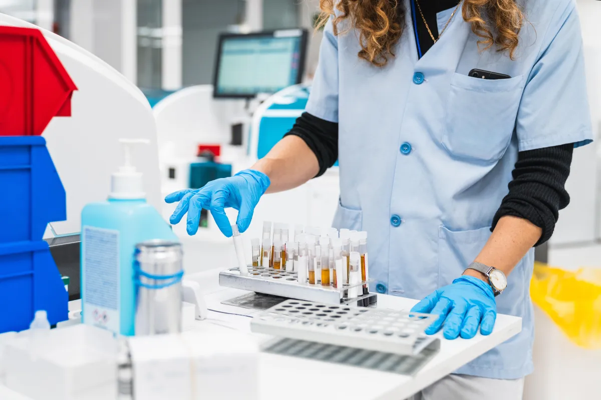 Pharmacy technician arranging medications and assisting pharmacist