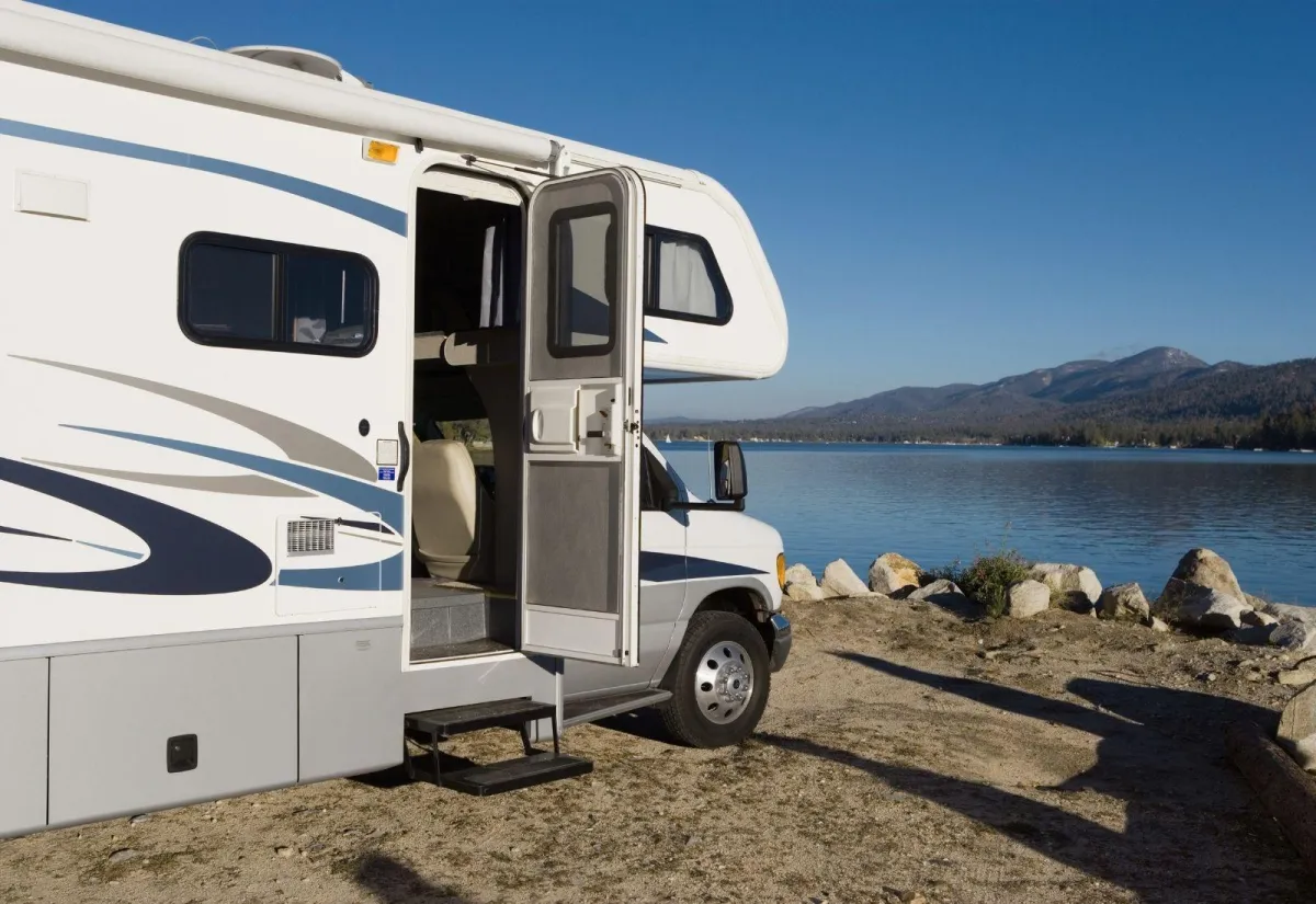 Man repairing a RV vent