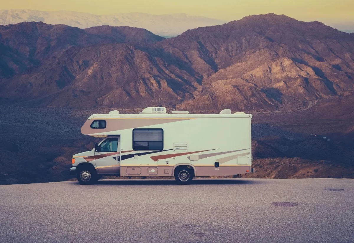 Man repairing a RV vent