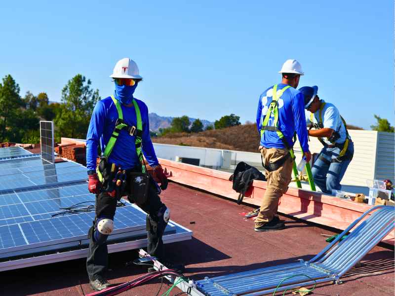 Roof replacement under existing solar panels in San Diego by McKay Roofing & Solar
