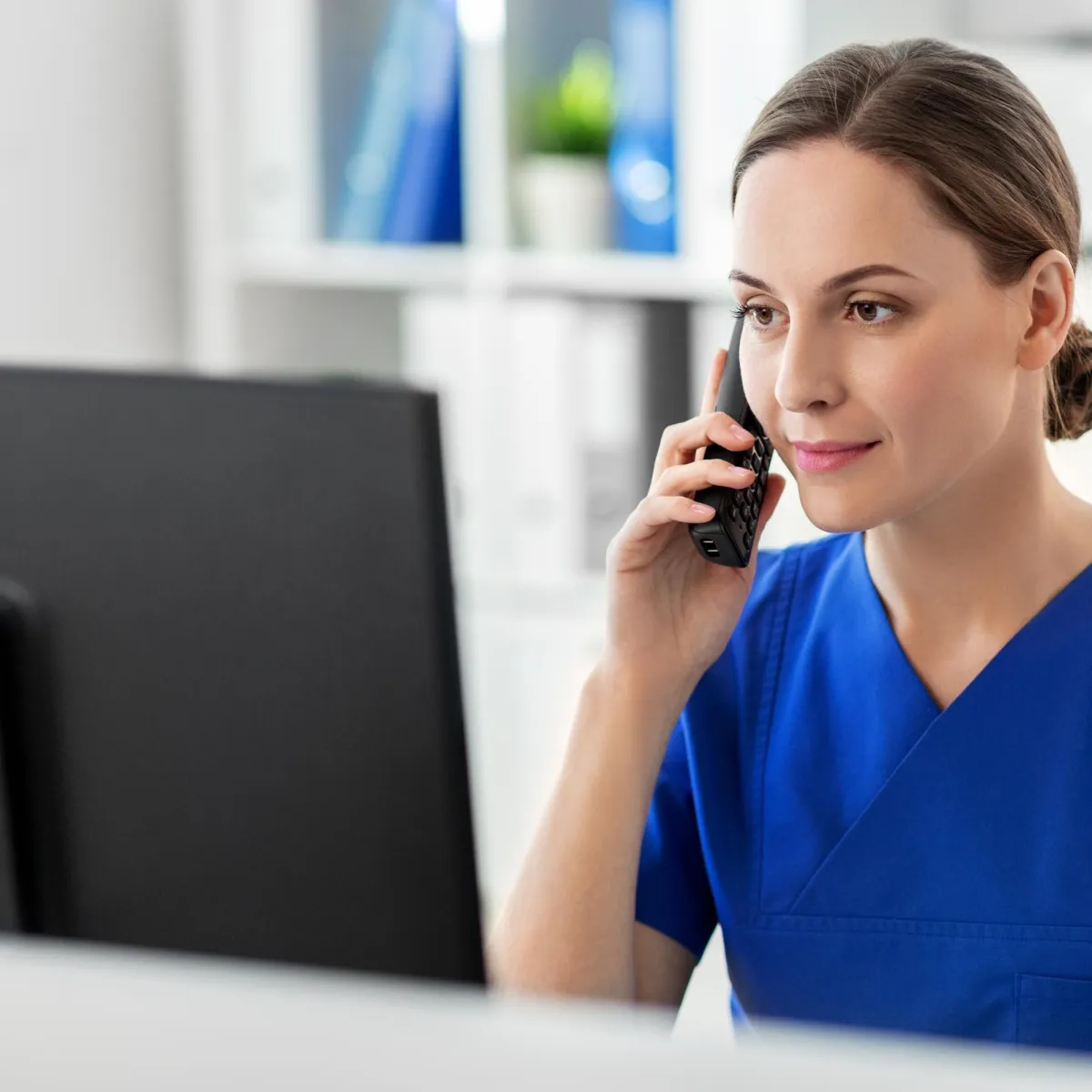 Female medical provider on the phone.