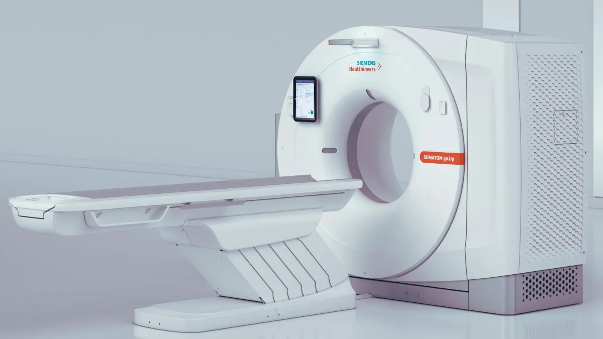 A large medical imaging machine with a circular opening, used for CT scans.