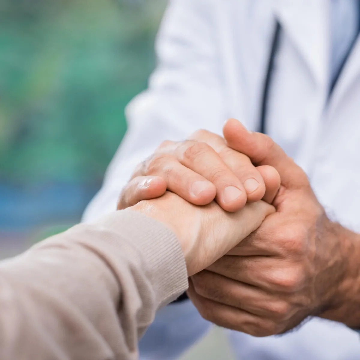 Doctor comforting a patient.