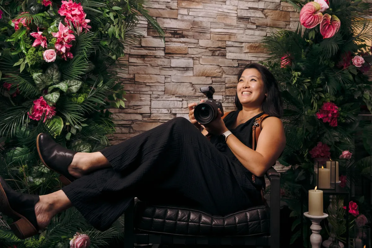 a person holding a black book with the word guests on it