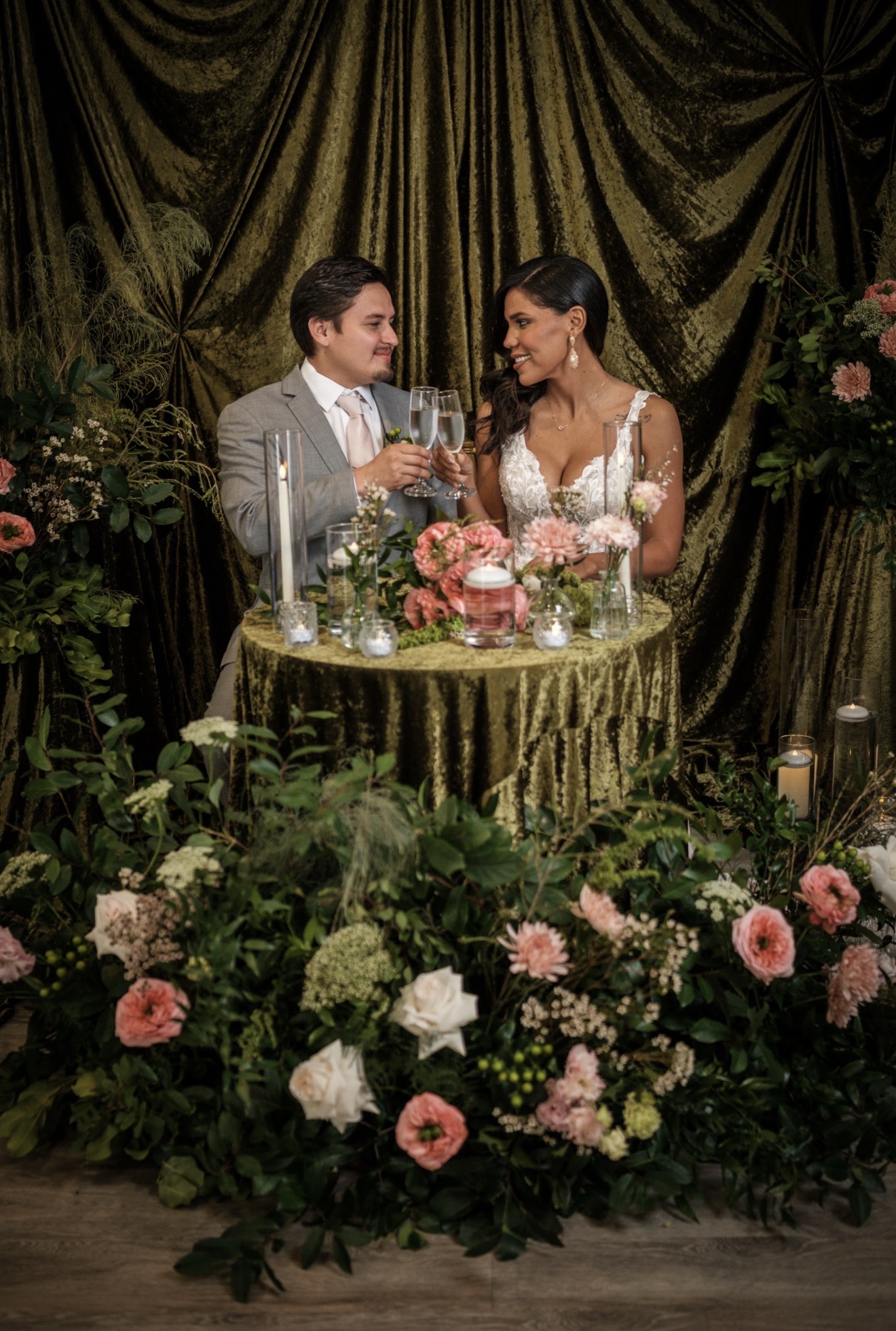 Wedding party celebrating outdoors with bouquets