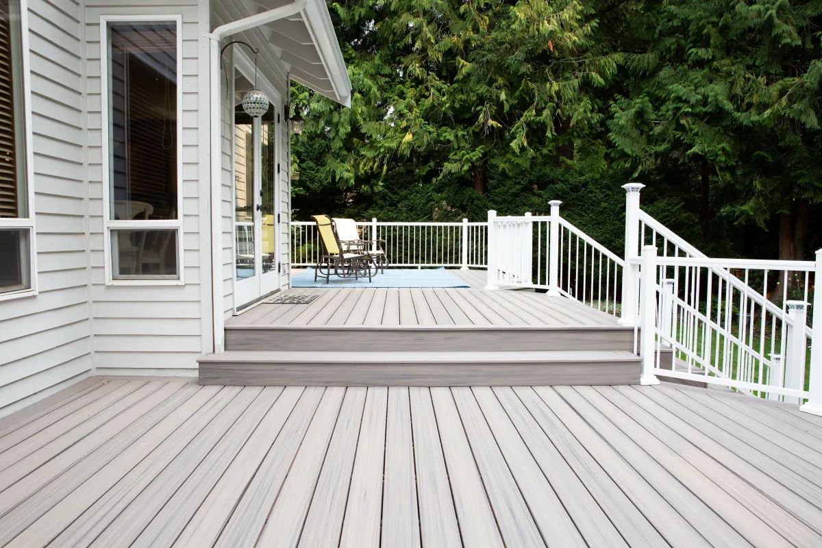 a group of people standing outside of a building under construction