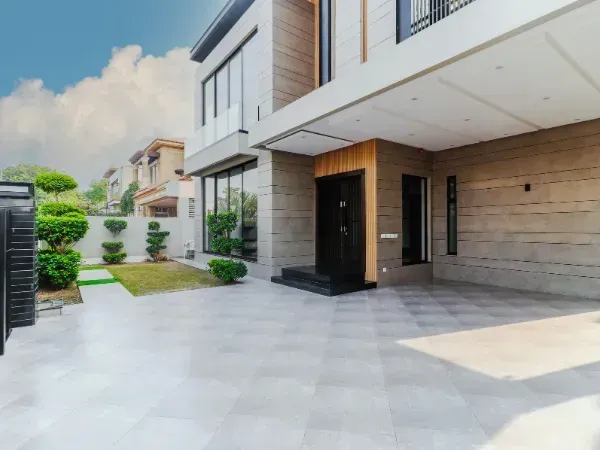 Suburban home with a clean concrete driveway and attached garage.