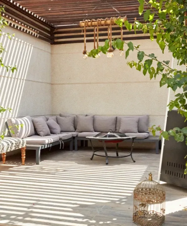 Outdoor patio area with furniture after professional pressure washing. 