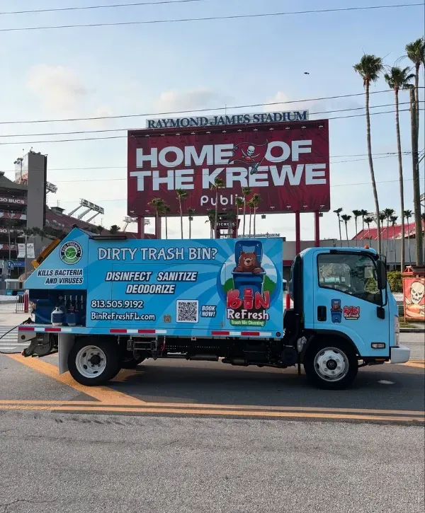 Bin Refresh trash bin cleaning truck parked near Raymond James Stadium promoting sanitation services