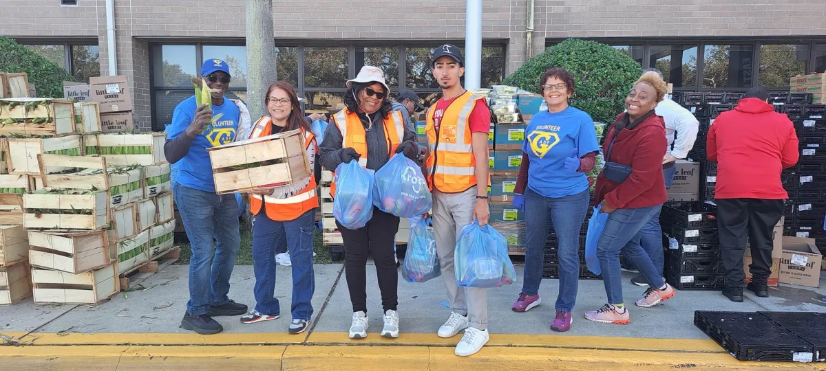 A man holding a woman in a pink room