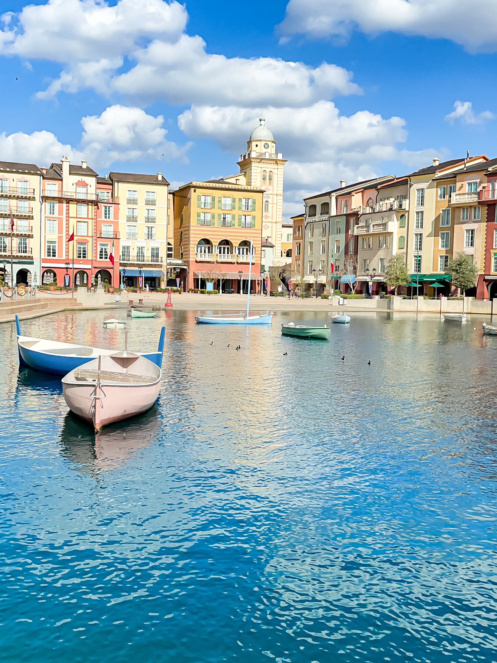 Loews Portofino Bay Resort at Universal Orlando with a water view with Italian inspired architecture and themed boats floating in the water.