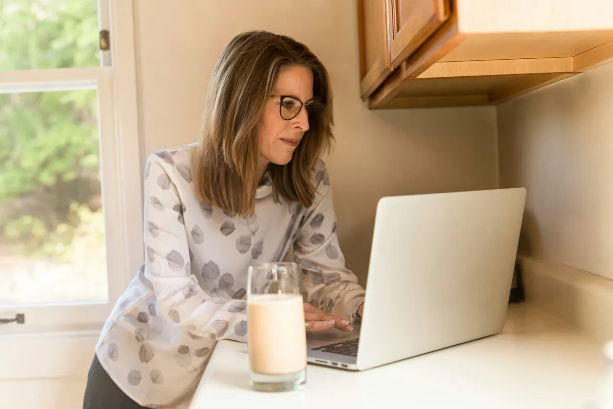 Founder on a computer in their home