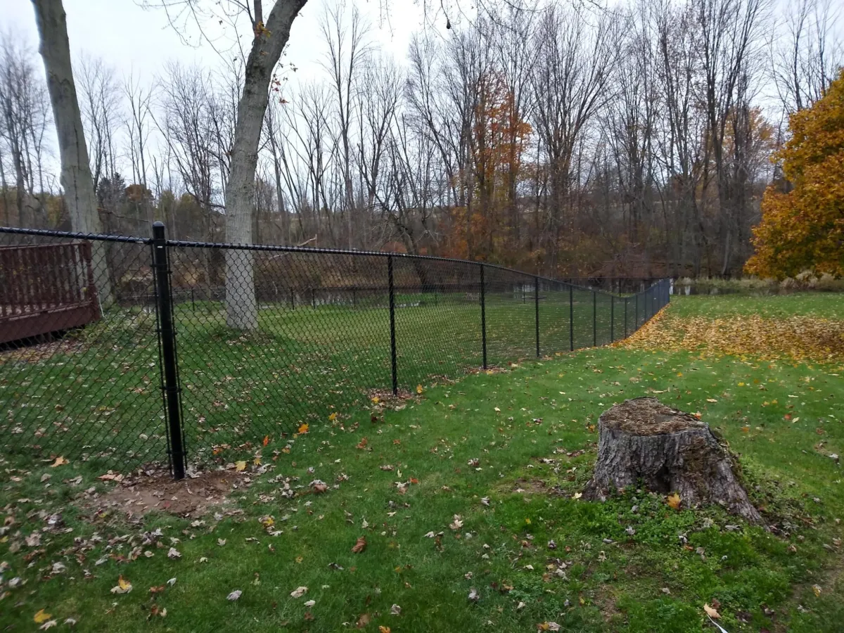 a red fence in a field