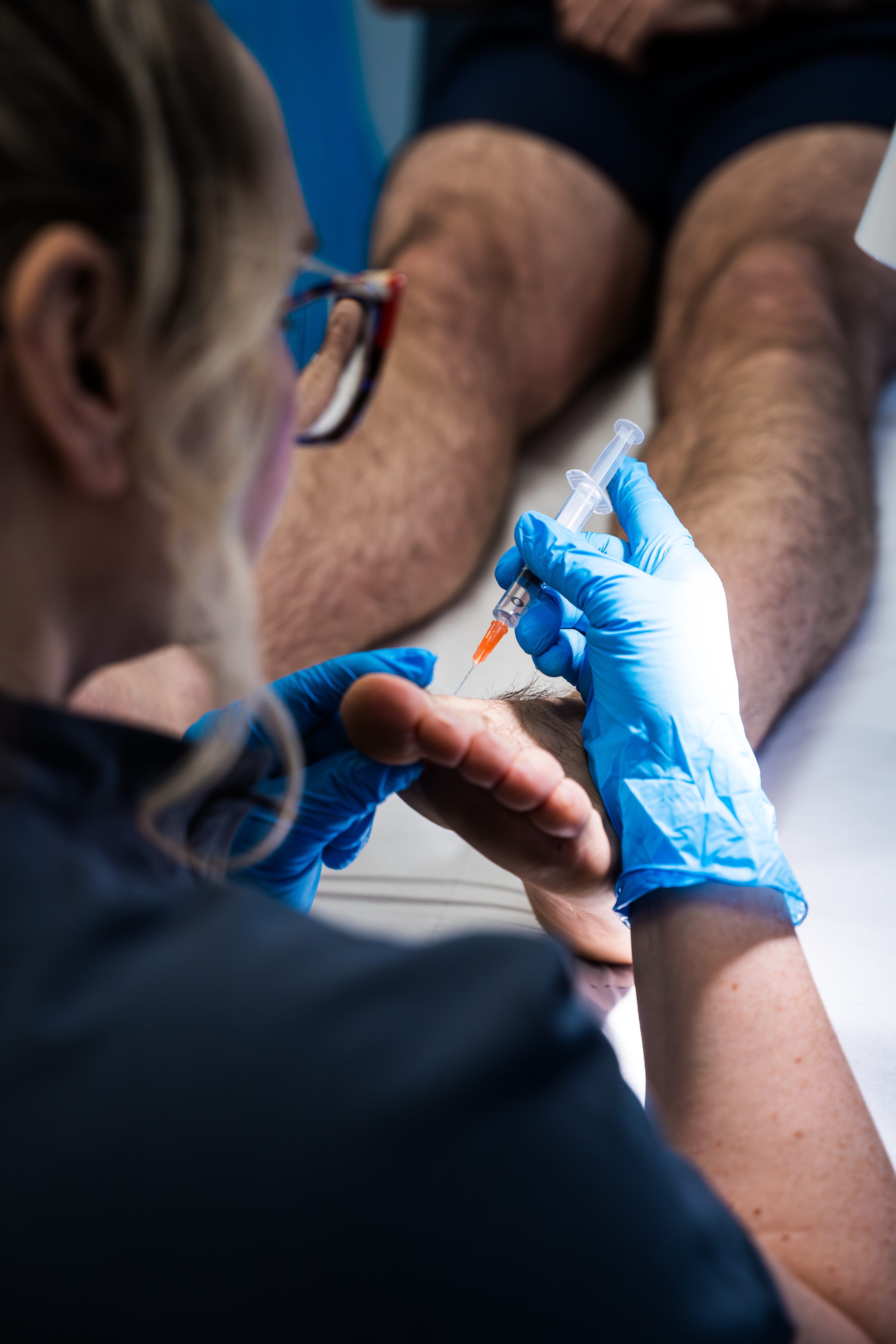 Luxurious podiatry clinic reception with marble desk and plush seating