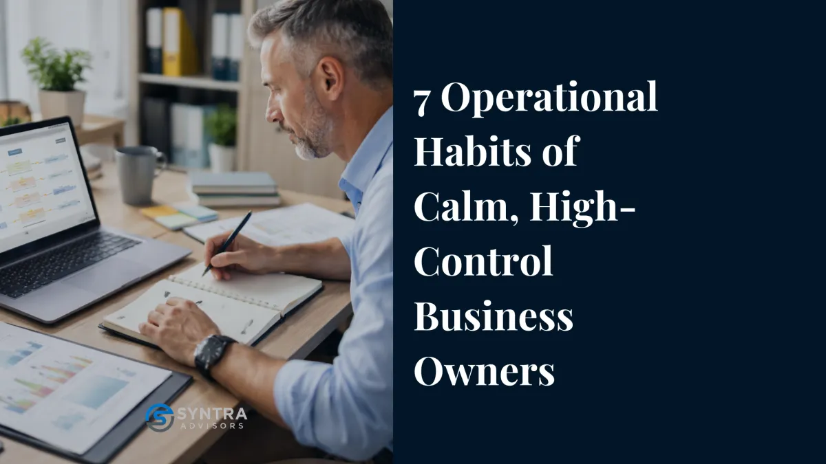 Service business owner reviewing operational workflows on a laptop while organizing notes and systems to reduce decision bottlenecks and improve business structure.