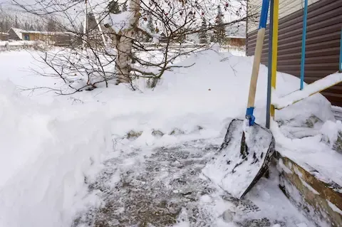 Shoveled front entrance walkway after snow removal service in Hartford