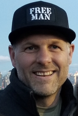 Photo of a warm, approachable parenting coach smiling in a cozy setting.