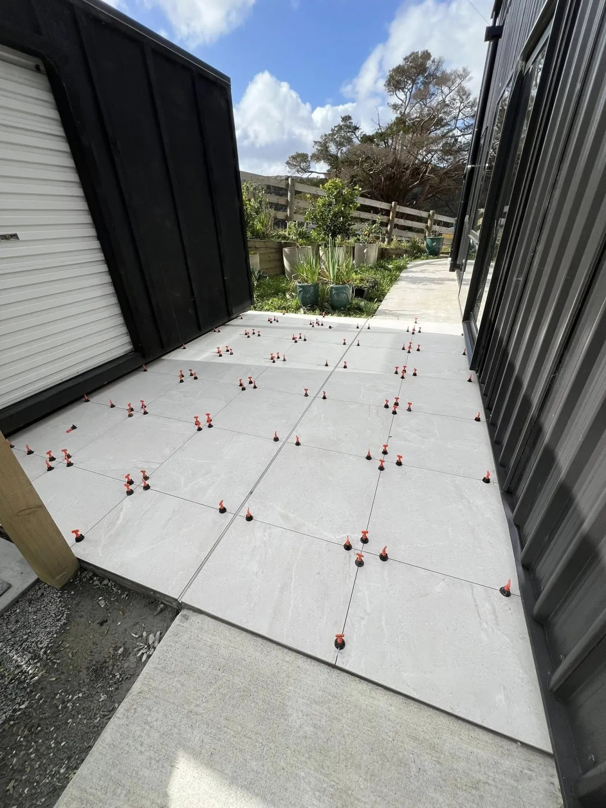 Outdoor patio tiling project North Shore Auckland by NVN Tiling Ltd