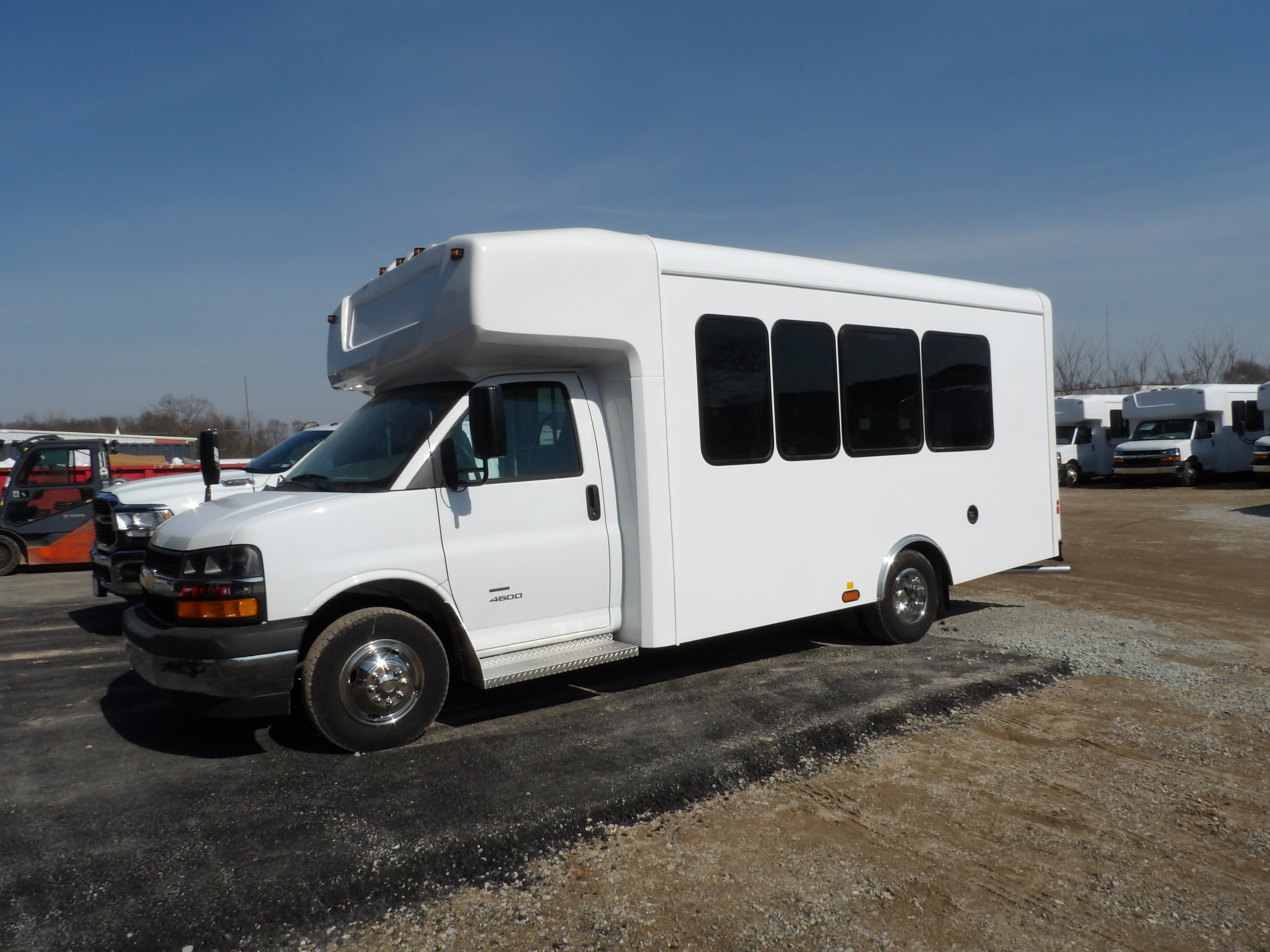 HLE 14-passenger shuttle bus, driver side with rear luggage compartment