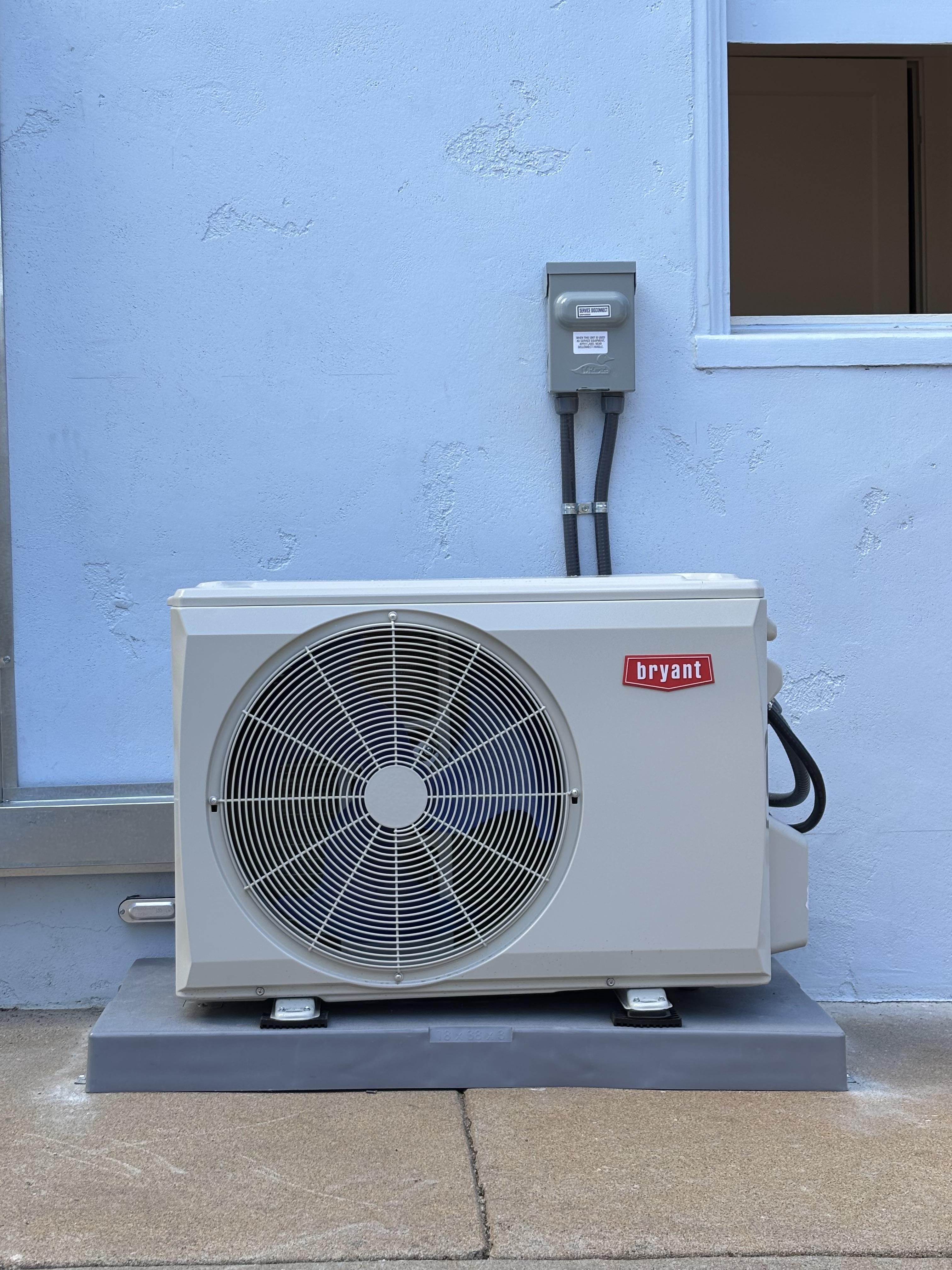 Certified Luna HVAC technician performing a residential AC system diagnostic and maintenance check in Marina, CA.