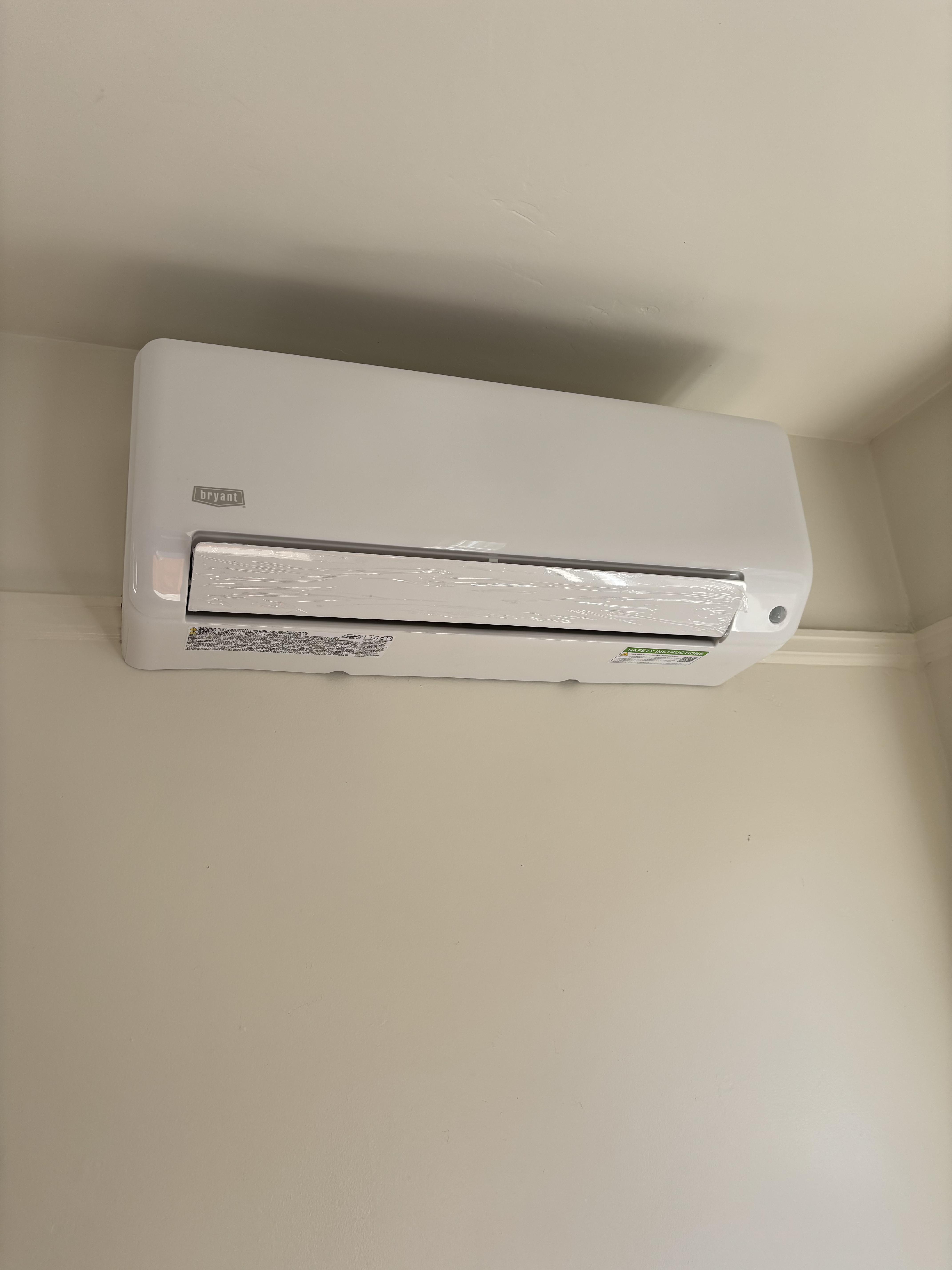 Certified Luna HVAC technician performing a residential AC system diagnostic and maintenance check in Marina, CA.