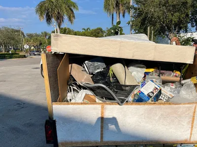 A trailer full of debris to be hauled off to the dump.