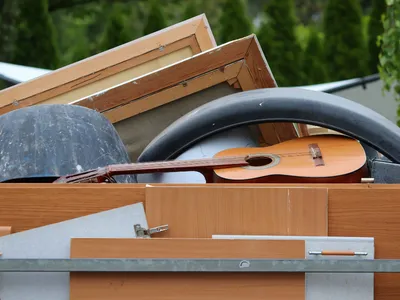 A pile of wood and things to be taken out for trash.