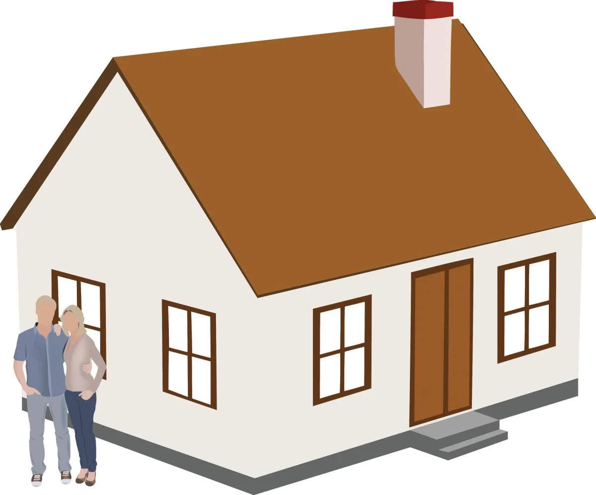 house with a couple standing next to it