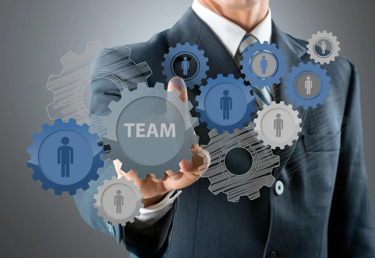 a kitchen with a marble counter top and white cabinets