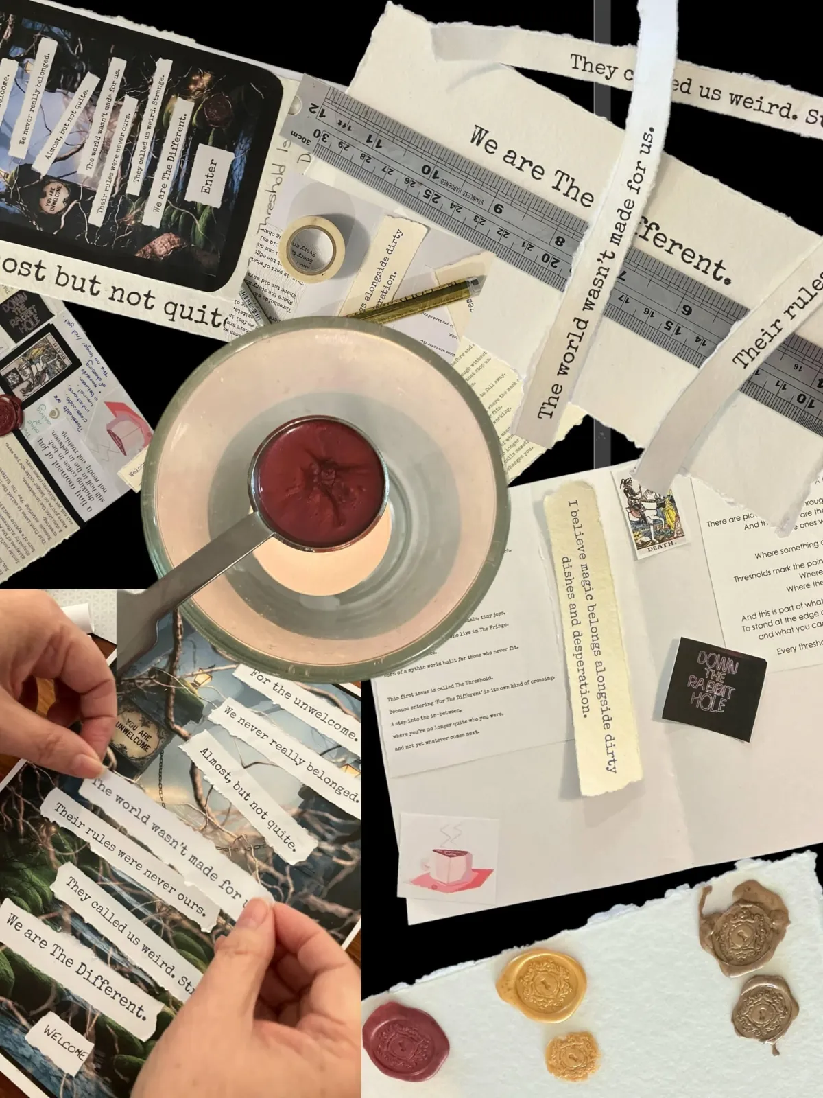A collage of hand-made zine elements and art materials arranged on a black background. Torn strips of cream parchment display typed phrases such as “We are The Different” and “The world wasn’t made for us.” A metal ruler and gold pen lie across the page. A small metal dish holds melted sealing wax with a wax seal stamp resting inside. A hand is carefully positioning a strip of words onto a printed image. Nearby are wax seals in burgundy, gold, and bronze, and scraps of text, tape, and paper.