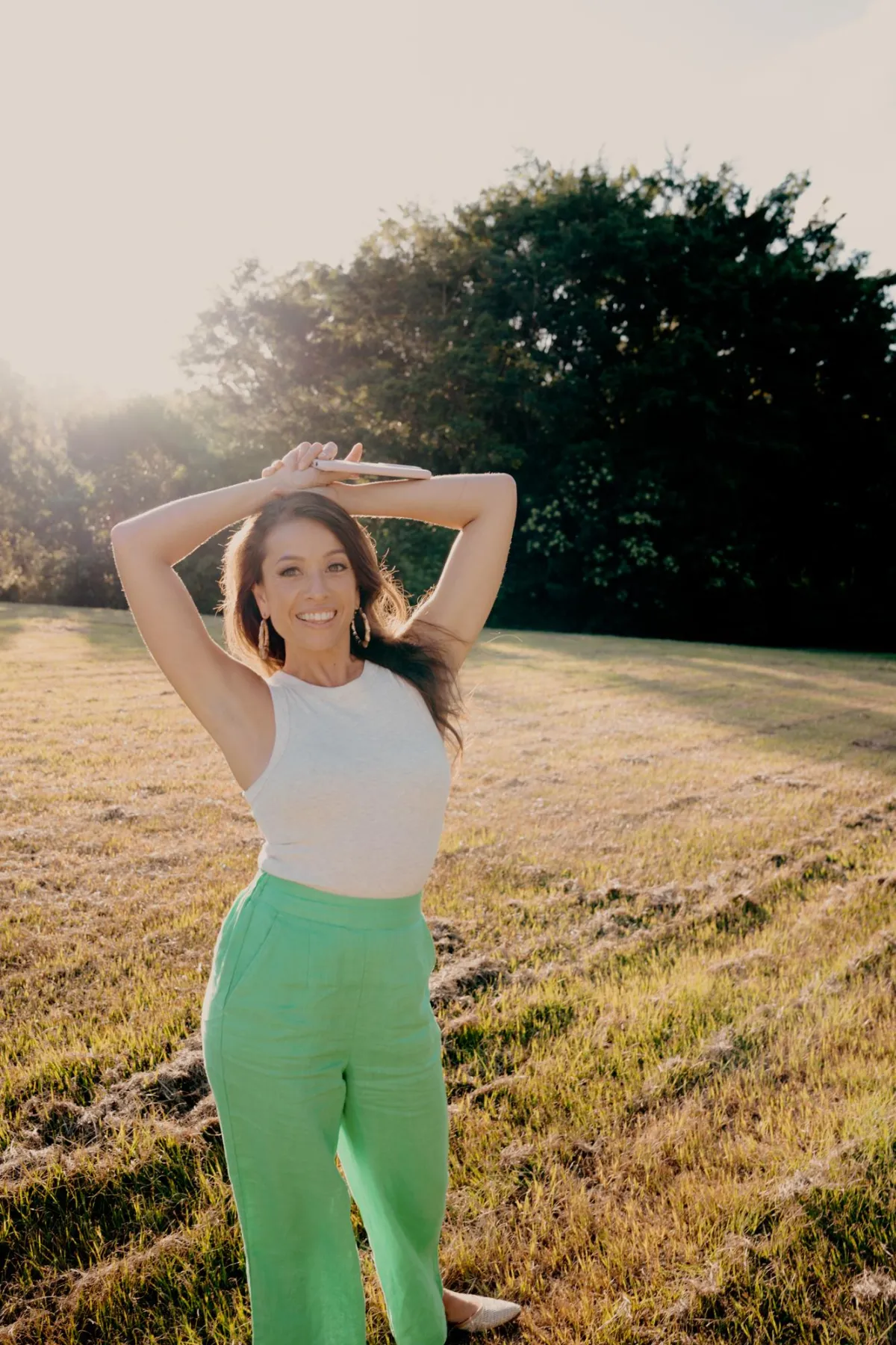 A table topped with plates of food and a smart device