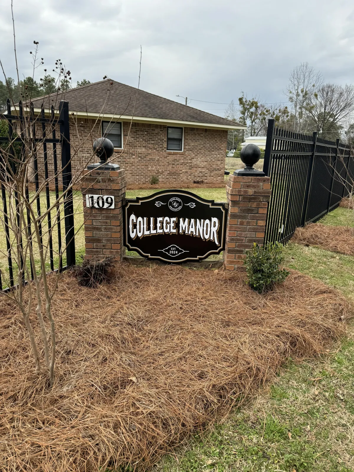 Front entrance to a housing community called College Manor