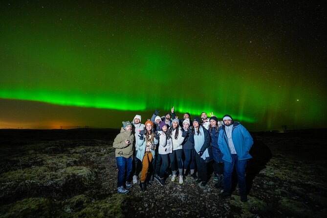 Traveler looking at the northern lights in Iceland