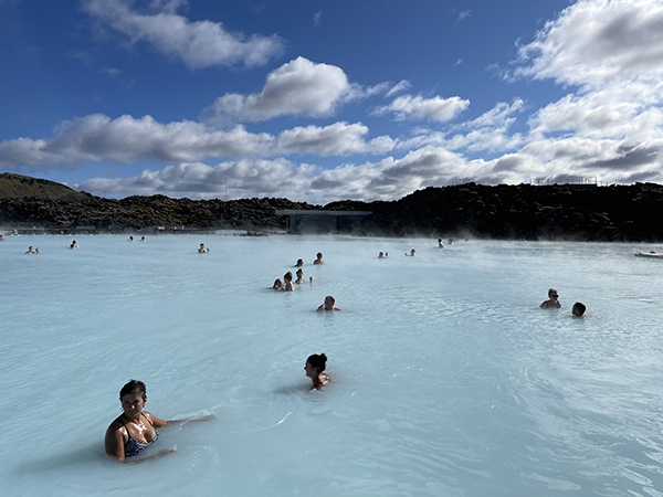 Luxurious geothermal waters of the Blue Lagoon surrounded by volcanic rock
